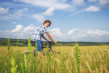 Portrait of a boy with a bicycle