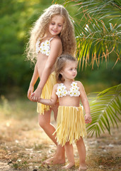 portrait of two sisters in tropical style © zagorodnaya