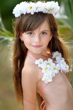 portrait of little girl in tropical style