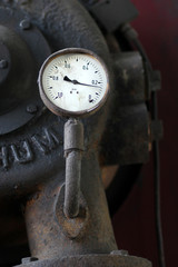 Old barometer connected to the old mechanical maсhine