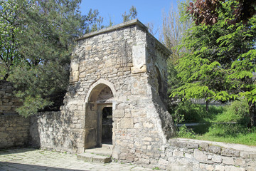 Fototapeta na wymiar Ancient portal next to the church of Saint Sarkis
