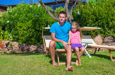 Father and daughter at tropical vacation having fun outdoor