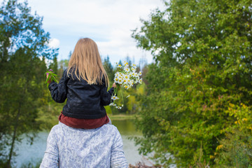 Young happy father with daughter in the park