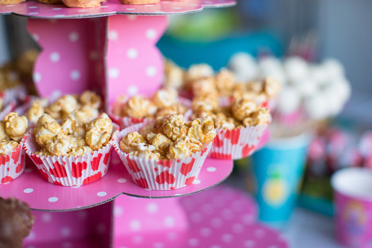 Portion Popcorn On Kid's Party On Sweet Dessert Table