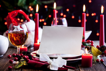 Christmas card in dishware at the table
