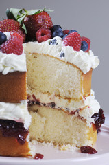 Fresh whipped cream and berries sponge layer cake.