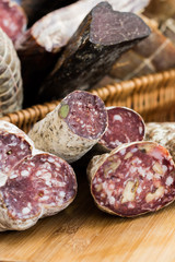 Salami at the market on wooden board