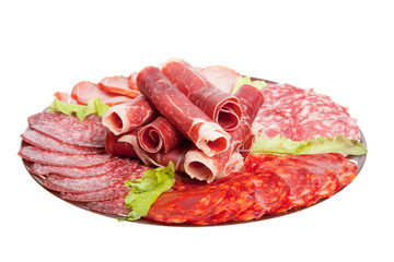 Plate with different meat delicacies isolated on white backgroun