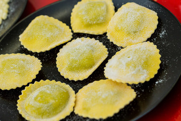 Raw ravioli on a plate