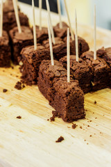 Chocolate brownies on wooden board