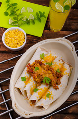 Baked meat tortilla with cheddar cheese