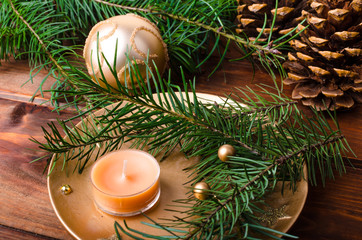 Christmas candle with pine needles