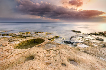 lit by the rays of the setting sun drawings on stones