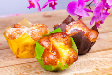 Sweet buns with jam on wood table