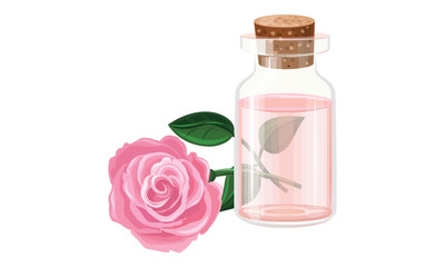 Rose oil in a glass bottle