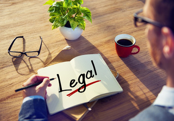 Man with a Note and a Single Word Legal