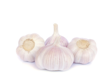 Garlic bulb and cloves on white background