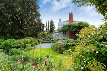 Fototapeta na wymiar Modern house with tennis court and garden. Tacoma real estate