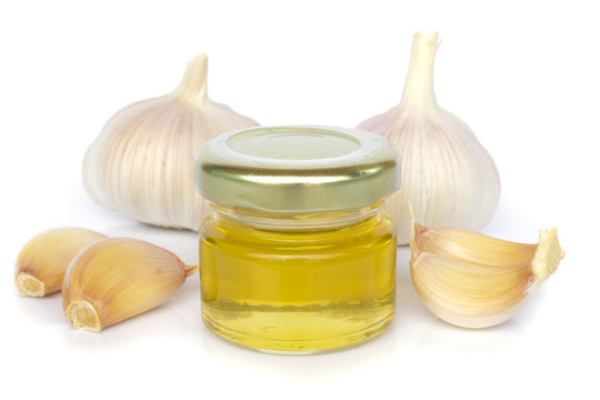 garlic bulbs and jar of honey as healthy eating