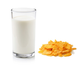 Cornflakes and milk on white background