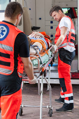 Paramedics taking unconscious girl to hospital