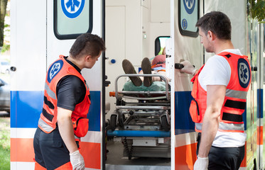 Woman lying on stretcher in ambulance © Photographee.eu