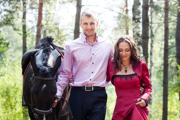 Obraz premium happy couple and horse