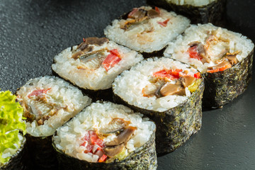 Salmon and caviar rolls served on a plate