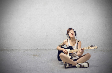 Fototapeta na wymiar Girl playing guitar