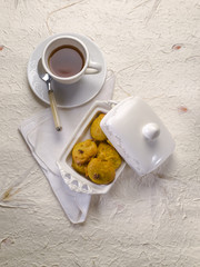 cookie with dried grape and cup of tea