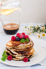 Pancakes with berries and honey
