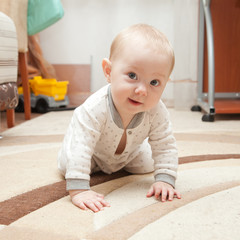 Six month old baby on the carpet