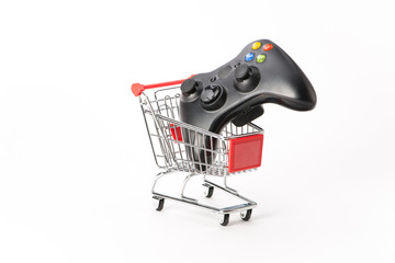 Caddy for shopping with game pad © Studio_3321