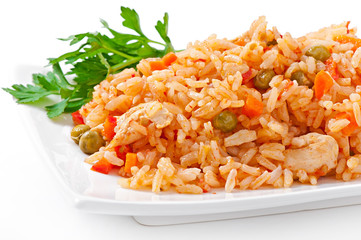 Pilaf with chicken, carrot and green peas