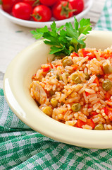 Pilaf with chicken, carrot and green peas