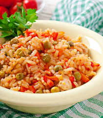 Pilaf with chicken, carrot and green peas