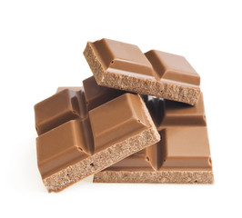 Closeup detail of chocolate parts on white background.