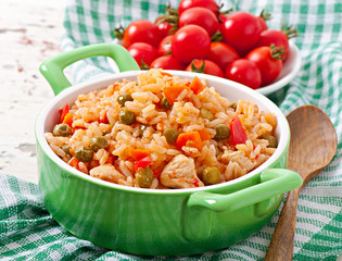 Pilaf with chicken, carrot and green peas