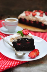 Chocolate brownies with strawberry and meringue, selective focus