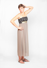 Fototapeta premium Young woman dressed in retro style evening dress.