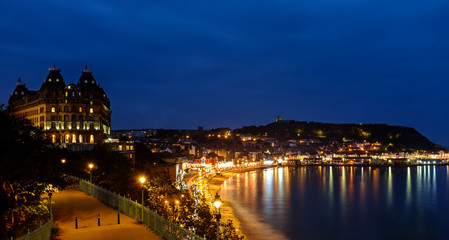Fototapeta na wymiar Scarborough Grand Hotel and harbour at night