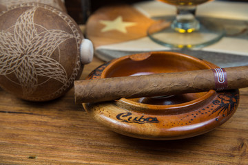 Cigars and Rum or alcohol on table