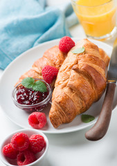 breakfast with croissants  and juice