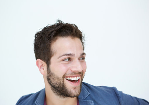 Cool guy with beard laughing on white background