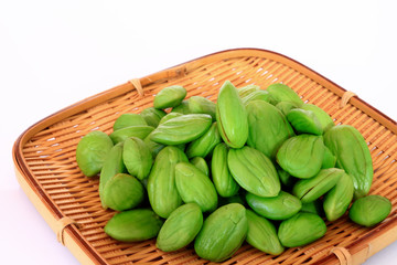 Tropical stinking edible beans in basket. (Parkia Speciosa)