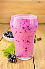 Milkshake with black currants on board
