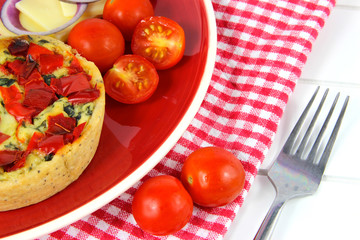 Healthy lunch Close up. Quiche, cheese, tomatoes, red onion.