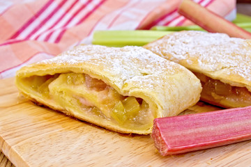 Strudel with rhubarb on linen tablecloth