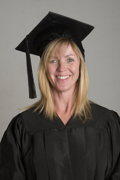 Mature university student in cap and gown