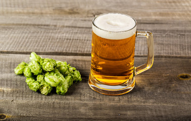 Glass beer on wood background with copyspace